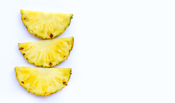 fresh pineapple slices on white background