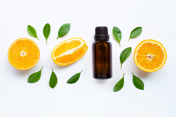 essential oil with fresh orange citrus