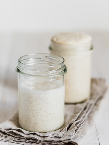 Wheat sourdough starter different hydration levels - Stock image ...