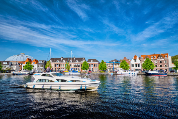 boats and houses on spaarne river
