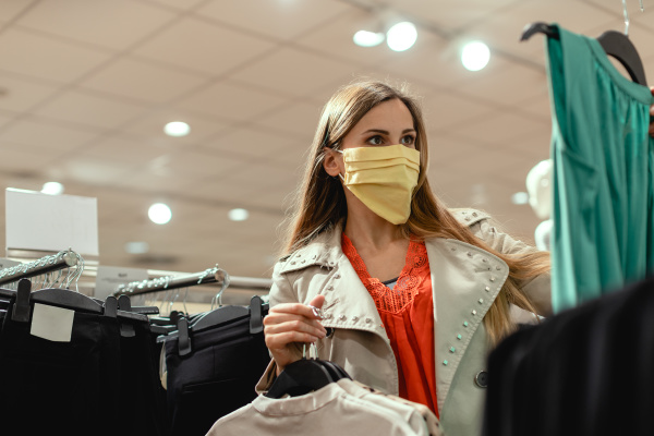 woman shopping in fashion store wearing