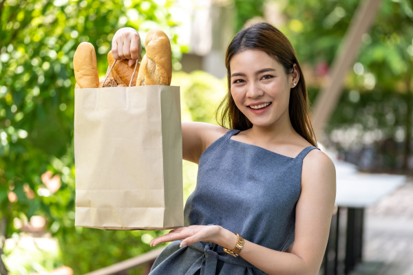 asian woman with grocery bag