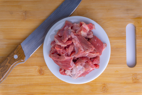 fresh raw beef steak on wooden