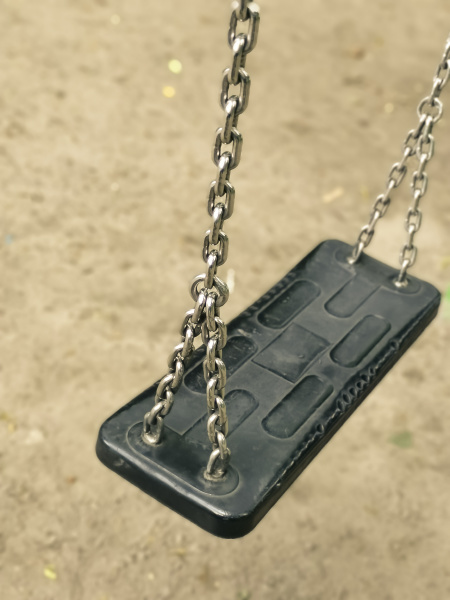 empty swing on kids playground