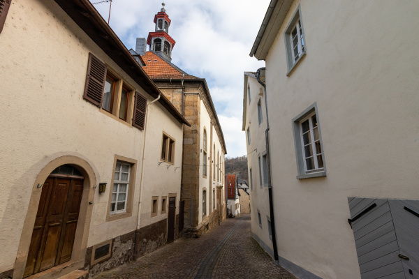 cobbled road with historic houses in