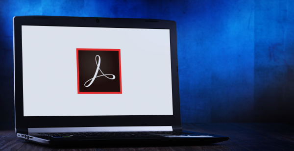 laptop computer displaying logo of adobe