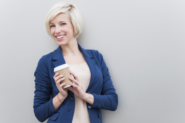 portrait of blond businesswoman with coffee