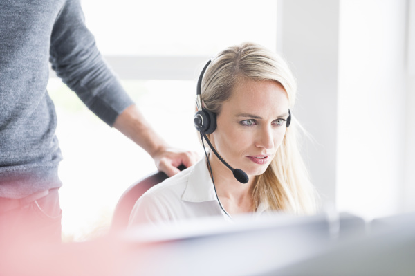 female customer service representative wearing headset