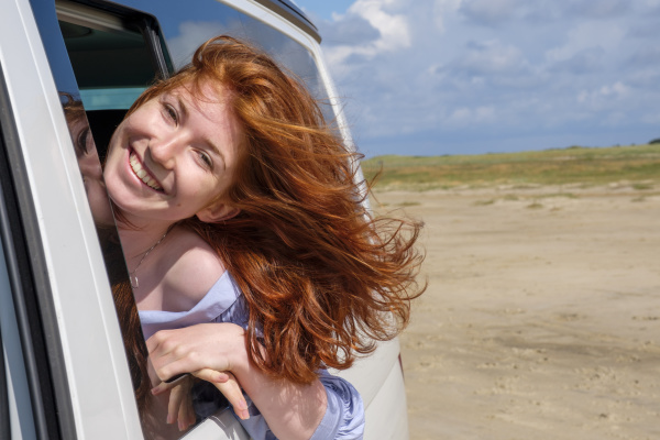 portrait of carefree redhead teenage girl