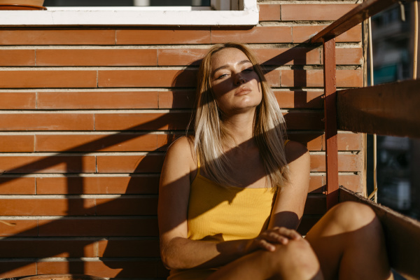 sunlight on young woman relaxing while