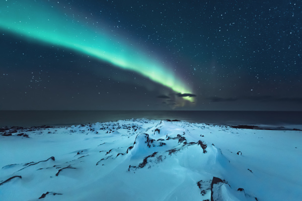 northern lights above the beach