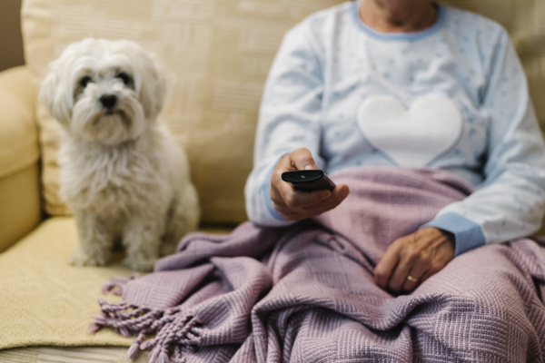 retired ill woman sitting by dog