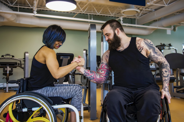 two paraplegic friends pretending to arm