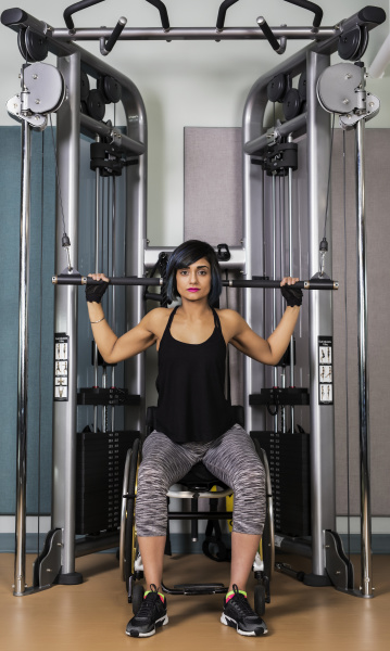 a paraplegic woman working out using