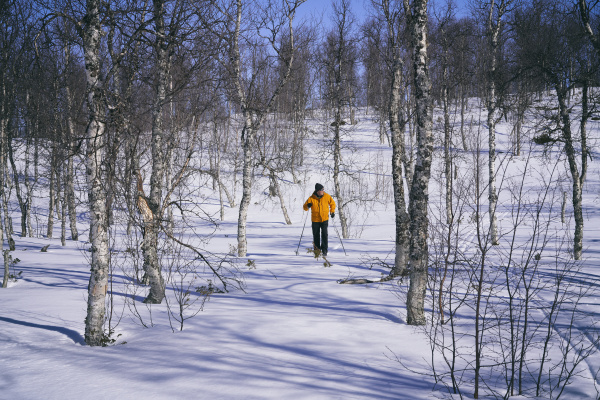 man cross country skiing in vasterbottens