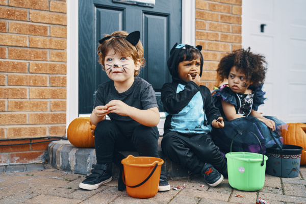 three children dressed up for halloween