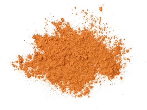 cinnamon powder isolated over white background