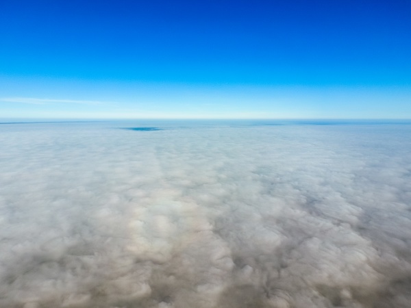 in the skies above the fog