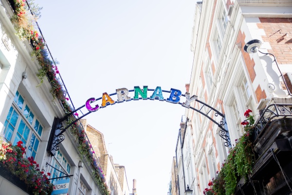 the carnaby street colorful signboard hanging