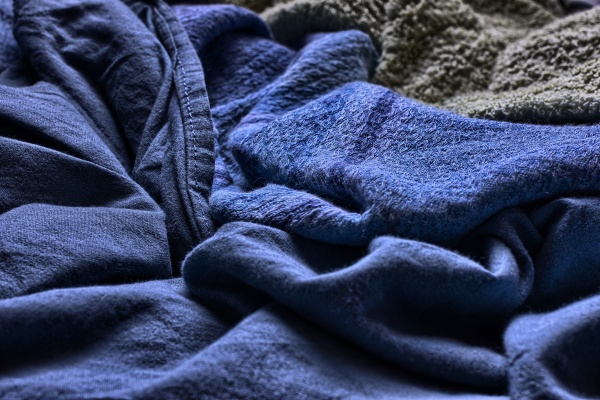 closeup of a messy blue blanket