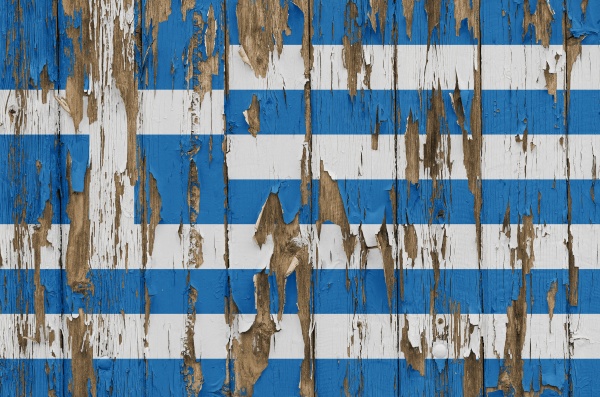 flag of greece on a weathered