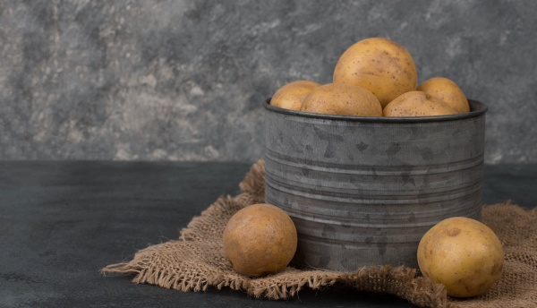 fresh potatoes in a basket on
