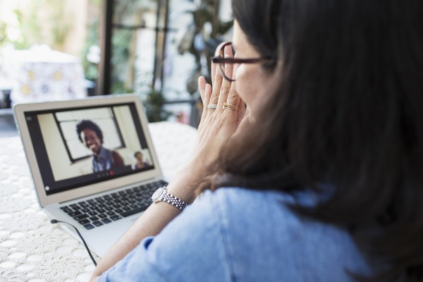 woman video conferencing with colleagues at