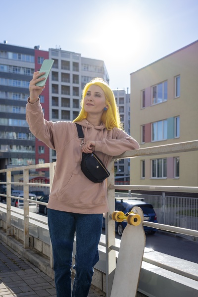 young woman taking selfie on smart