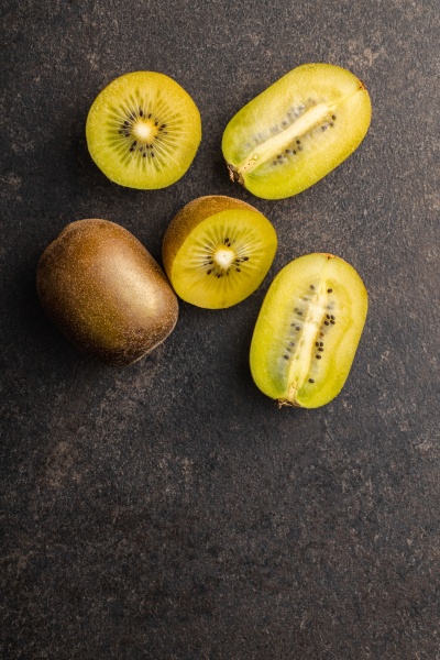halved ripe yellow kiwi fruit
