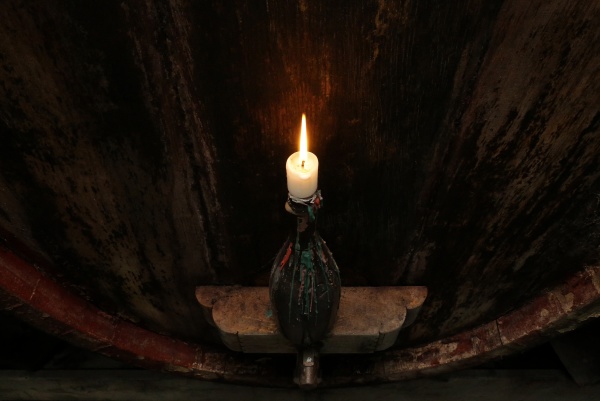 candle in front of a wooden
