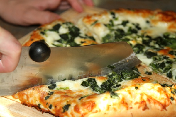 closeup of sliced spinach and cheese