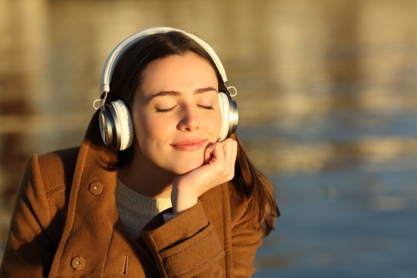 woman listening to music relaxing at
