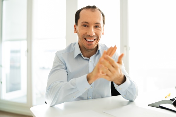 man clapping in video conference