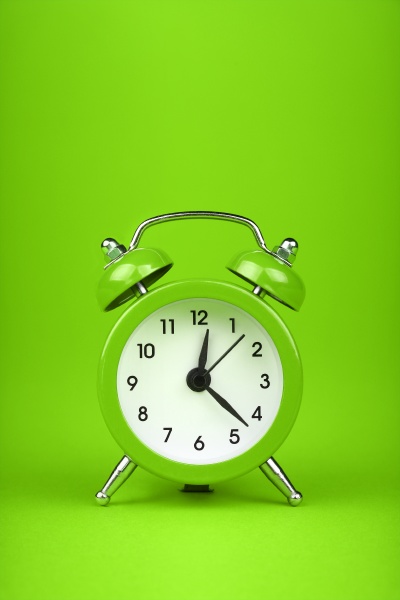 close up one green alarm clock