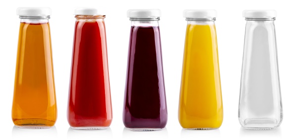 the glass bottles of juice isolated