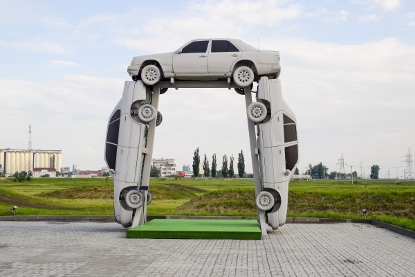 homemade sculpture of three cars