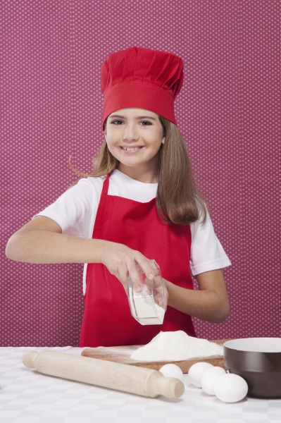 portrait of a girl putting flour