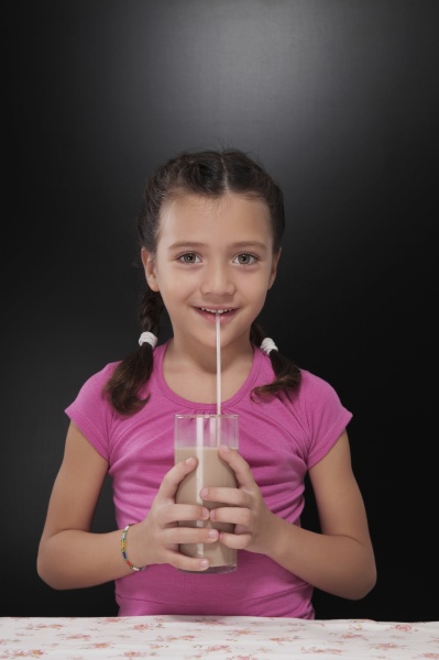 girl drinking chocolate milkshake