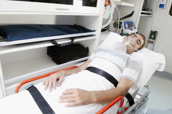 patient lying in an ambulance