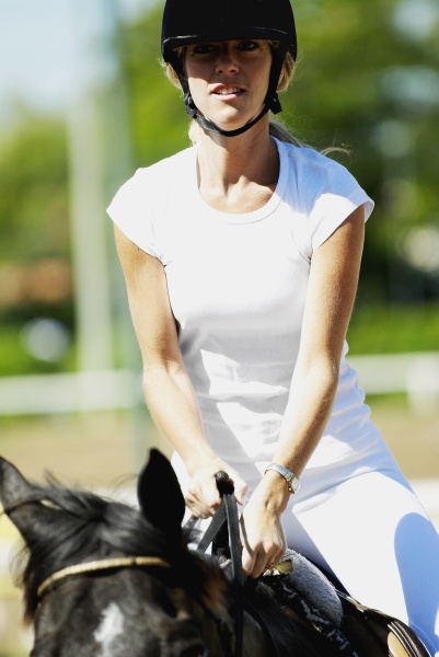 mid adult woman horseback riding