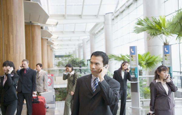 business executives talking on mobile phones