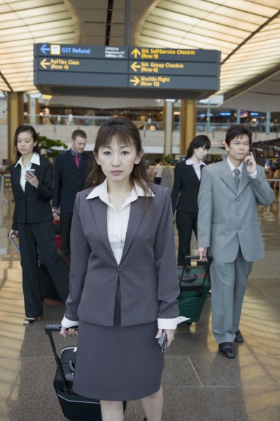 business executives leaving an airport