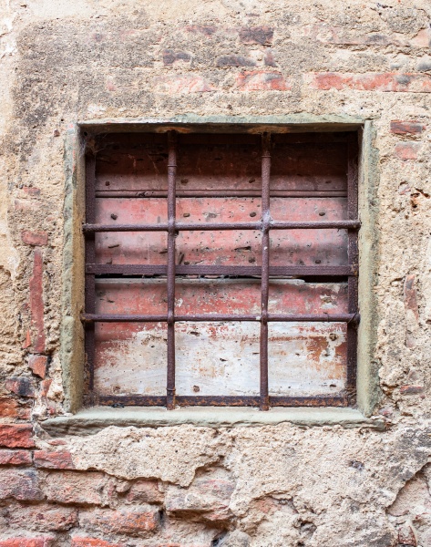 old window with iron gratings