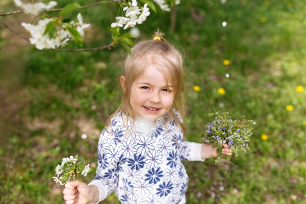little girl with spring flowers on
