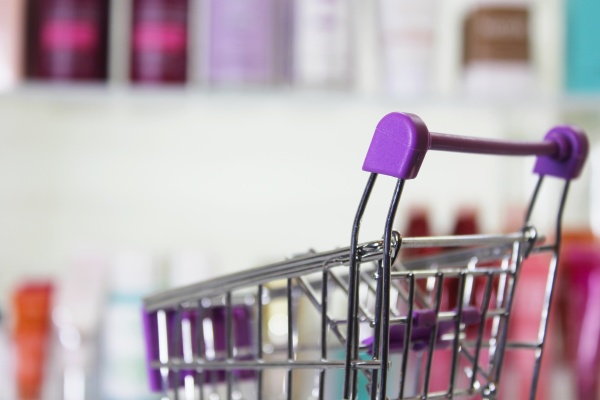 empty shopping basket with blurred cosmetics