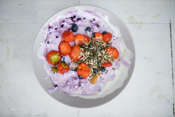 bowl of berries and yogurt with