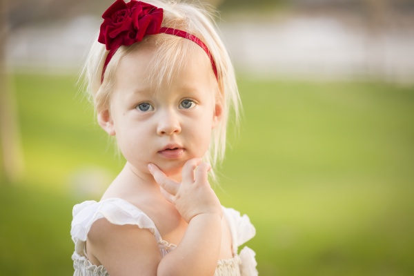 adorable little girl wearing white dress