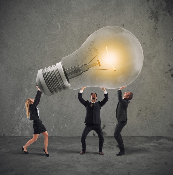 business people hold a light bulb
