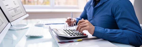 bookkeeper accountant calculating tax invoice