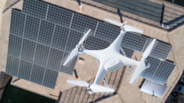 uav drone inspecting solar panels on